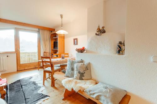 a living room with a couch and a table at Appartement RUDI by MoniCare in Reith bei Seefeld