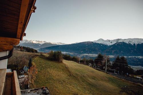 a view of a mountain range from a house at Appartement RUDI by MoniCare in Reith bei Seefeld