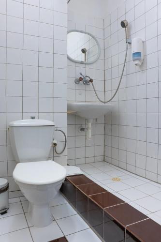 a bathroom with a toilet and a sink at Horská ubytovňa Hrebienok in Smokovce