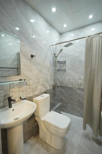 a bathroom with a toilet and a sink and a shower at Best way hostel in Yerevan