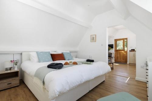 En eller flere senge i et værelse på The Old Potting Shed