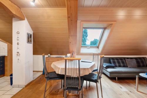 a living room with a table and a couch at Ferienwohnung Schweizer in Bernau im Schwarzwald