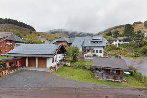 an aerial view of a village with a solar roof at Ferienwohnung Schweizer in Bernau im Schwarzwald