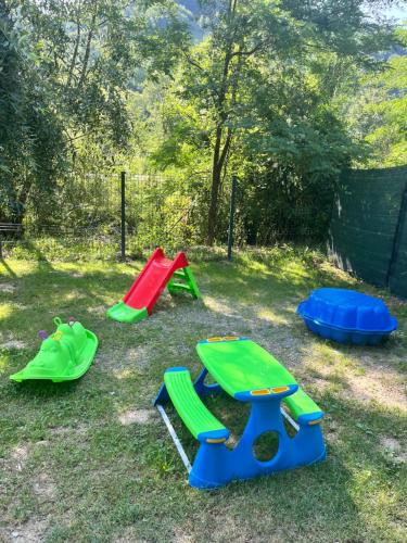 a group of play equipment in the grass at Roman A Frame Vișeu de Sus in Vişeu de Sus