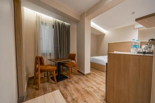 Postel nebo postele na pokoji v ubytování Kemet Hotel Tahrir Square