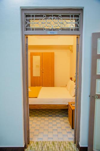 a bedroom with a bunk bed in a room at Maison Blanche DK in Puducherry