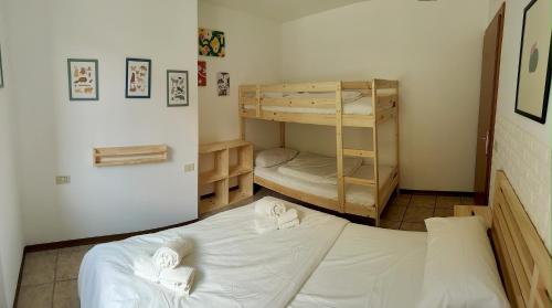 a bedroom with two bunk beds in a room at Il Terrazzino Val di Sole in Dimaro