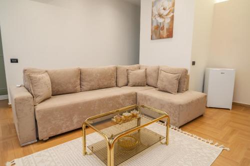 a living room with a couch and a coffee table at The Blue House in Široka