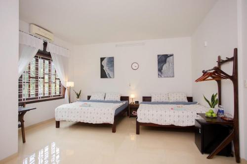 Postel nebo postele na pokoji v ubytování Green home, Huế