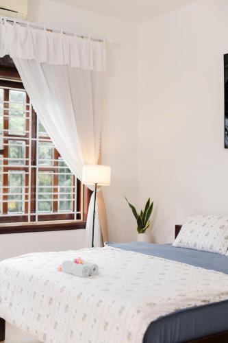 Postel nebo postele na pokoji v ubytování Green home, Huế