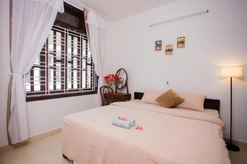 Postel nebo postele na pokoji v ubytování Green home, Huế
