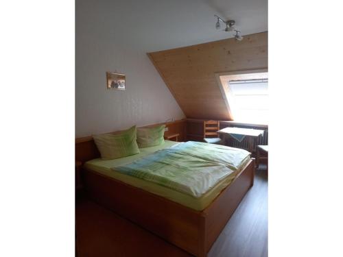 a bedroom with a bed in a room at Ferienwohnung Faller in Elzach