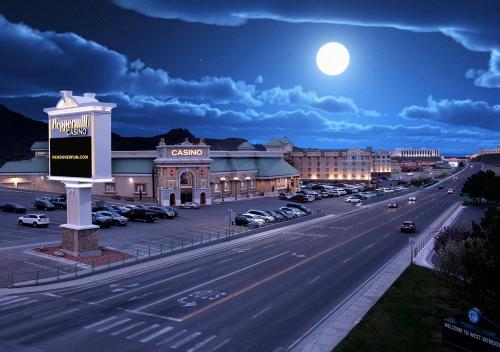a view of a city street at night with the moon at Peppermill Hotel Casino in W Wendover, Nevada in West Wendover