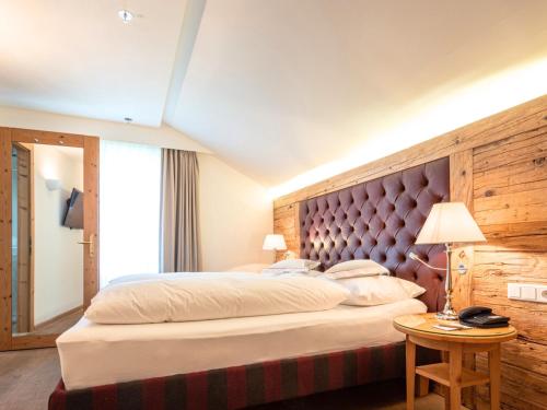 Postel nebo postele na pokoji v ubytování Hotel Kaiserhof Kitzbühel, 4 Sterne Superior