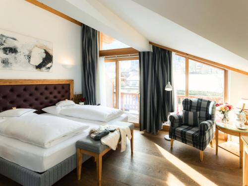 Postel nebo postele na pokoji v ubytování Hotel Kaiserhof Kitzbühel, 4 Sterne Superior