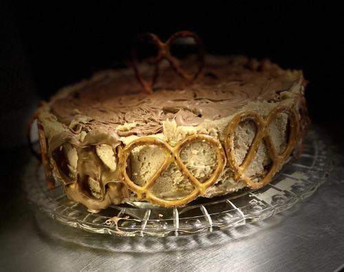 a chocolate cake with two hearts on a cooling rack at Singing Trees Inn Queen Bed Riverside Getaway in Glen Rose