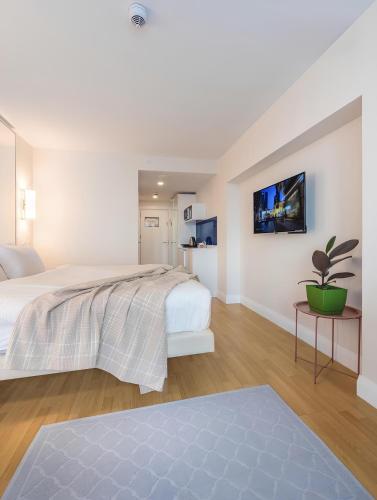 Ένα ή περισσότερα κρεβάτια σε δωμάτιο στο PANORAMA Resort - Center Suite & Sea View