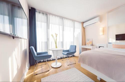 Ένα ή περισσότερα κρεβάτια σε δωμάτιο στο PANORAMA Resort - Center Suite & Sea View