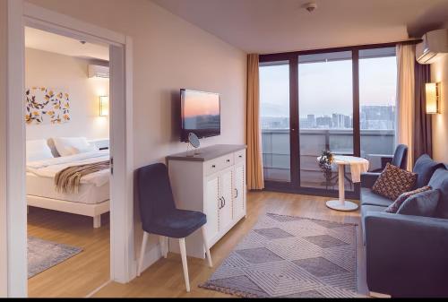 Ένα ή περισσότερα κρεβάτια σε δωμάτιο στο PANORAMA Resort - Center Suite & Sea View