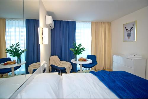 Ένα ή περισσότερα κρεβάτια σε δωμάτιο στο PANORAMA Resort - Center Suite & Sea View