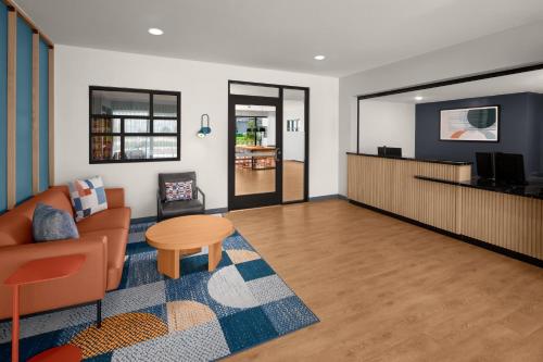 a living room with a couch and a table at StudioRes Fort Myers in Fort Myers