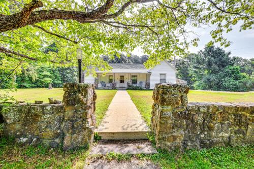 a stone wall in front of a house at Historic Hawkins House Located on Sewanee Campus in Sewanee