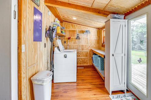 a small bathroom with a toilet and a door at Historic Hawkins House Located on Sewanee Campus in Sewanee