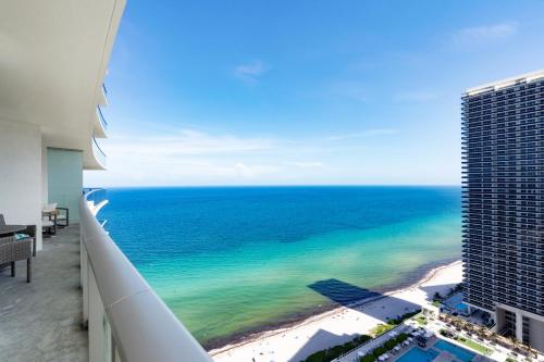 a view of the ocean from a balcony of a building at Picturesque Beachfront Condo - LOVELY 2BD and 2BA APT WITH DIRECT OCEAN VIEW in Hollywood