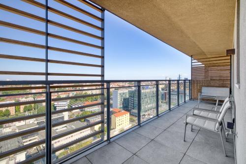 a balcony with a view of a city at Giax Tower - Stunning View 20th floor in Milan