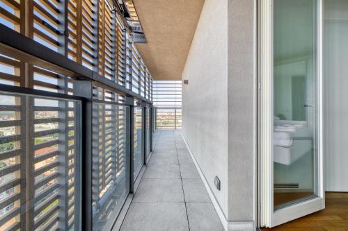 a hallway of a house with windows and a bathroom at Giax Tower - Stunning View 20th floor in Milan