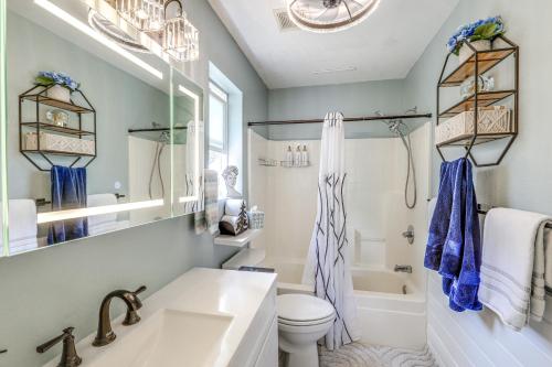 a bathroom with a sink and a toilet and a tub at Half-Mi to Trails Pet-Friendly Home in Flagstaff! in Mountainaire