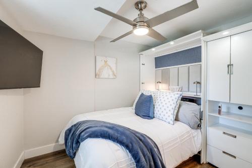 a bedroom with a bed and a ceiling fan at Half-Mi to Trails Pet-Friendly Home in Flagstaff! in Mountainaire