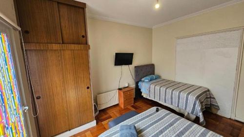 Postel nebo postele na pokoji v ubytování HOSTAL QUINTAMAR 6 Norte 985