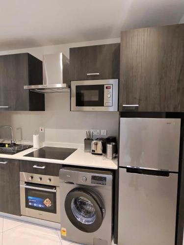 Η κουζίνα ή μικρή κουζίνα στο Chase luxury apartments at Loxwood House