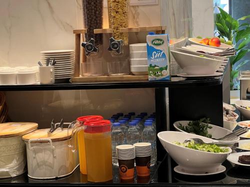 a refrigerator filled with lots of food and drinks at AXU AIRPORT HOTEL in Arnavutköy