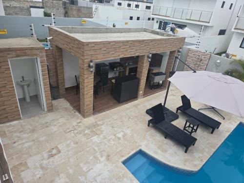 an overhead view of a rooftop patio with a table and chairs at Ark Villa in Punta Cana