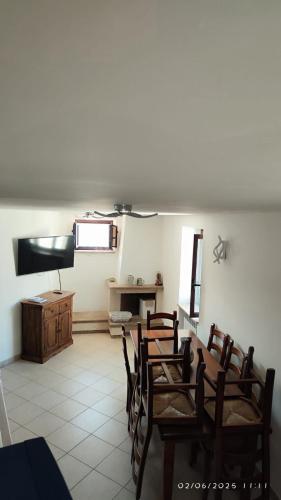 a room with chairs and a table and a desk at La Terrazza di Via Roma in Cetraro