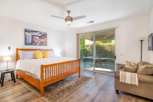 a bedroom with a bed and a couch at Oasis in Indio, La Quinta with Private Pool & Spa in Indio