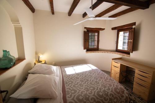 Ένα ή περισσότερα κρεβάτια σε δωμάτιο στο Casa Arbolitos Rooms & Garden