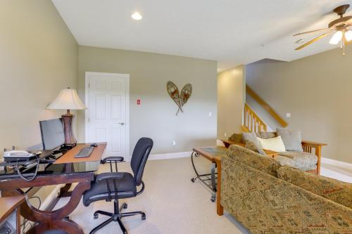 a living room with a couch and a desk at Less Than Half-Mi to Lake Townhome with Hot Tub in McHenry! in McHenry