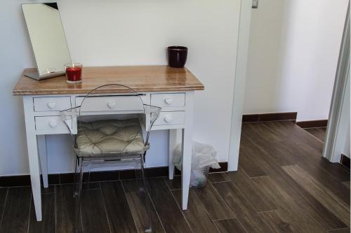 a desk with a chair in a room at Brezza Marina by Paolo in Barletta