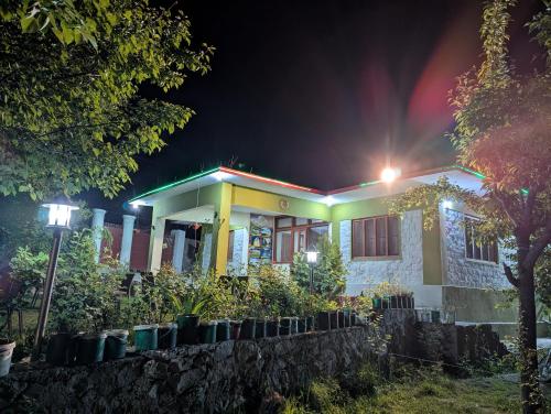 a house with a light on it at night at The Himalayan Guest House in Skardu