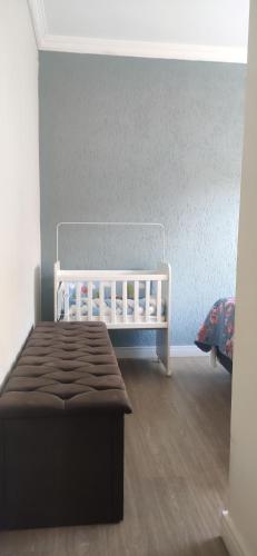 Ένα ή περισσότερα κρεβάτια σε δωμάτιο στο Apartamento inteiro com área e garagem privativa