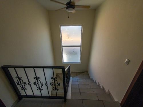 a stairway with a window and a stair railing at Casa Costamar 