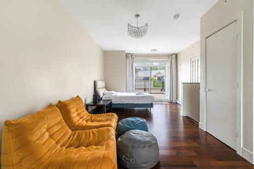 a living room with a couch and a bed at Family-Friendly 5BR Home Near UBC in Vancouver