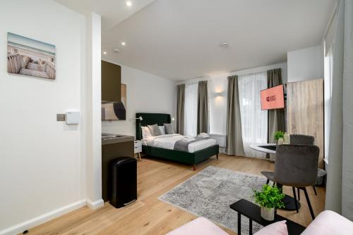 Ένα ή περισσότερα κρεβάτια σε δωμάτιο στο GuestReady - Greenwich Park Studios