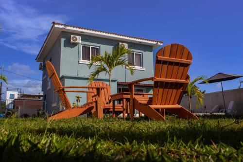 two chairs and a table in front of a house at Casa Costamar 