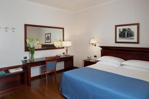 Postel nebo postele na pokoji v ubytování Starhotels Excelsior