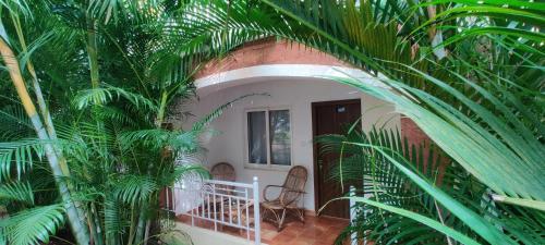 a view of a house through an arch of plants at Passions de Goa in Anjuna