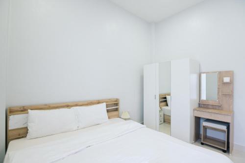 Ένα ή περισσότερα κρεβάτια σε δωμάτιο στο AABAN House 04